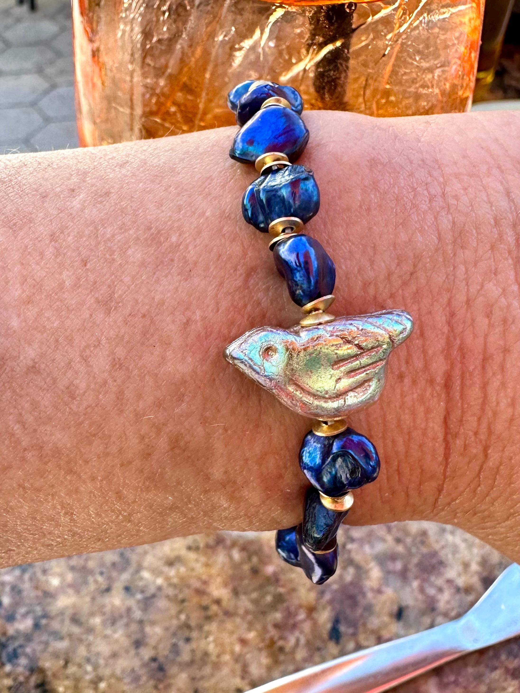 Freshwater Blue Pearl Bracelet With A Gold Songbird Charm