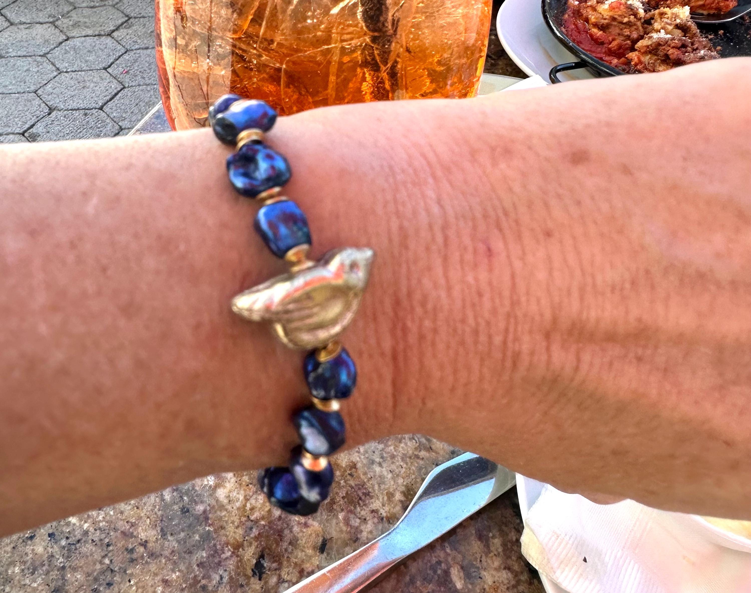 Freshwater Blue Pearl Bracelet With A Gold Songbird Charm