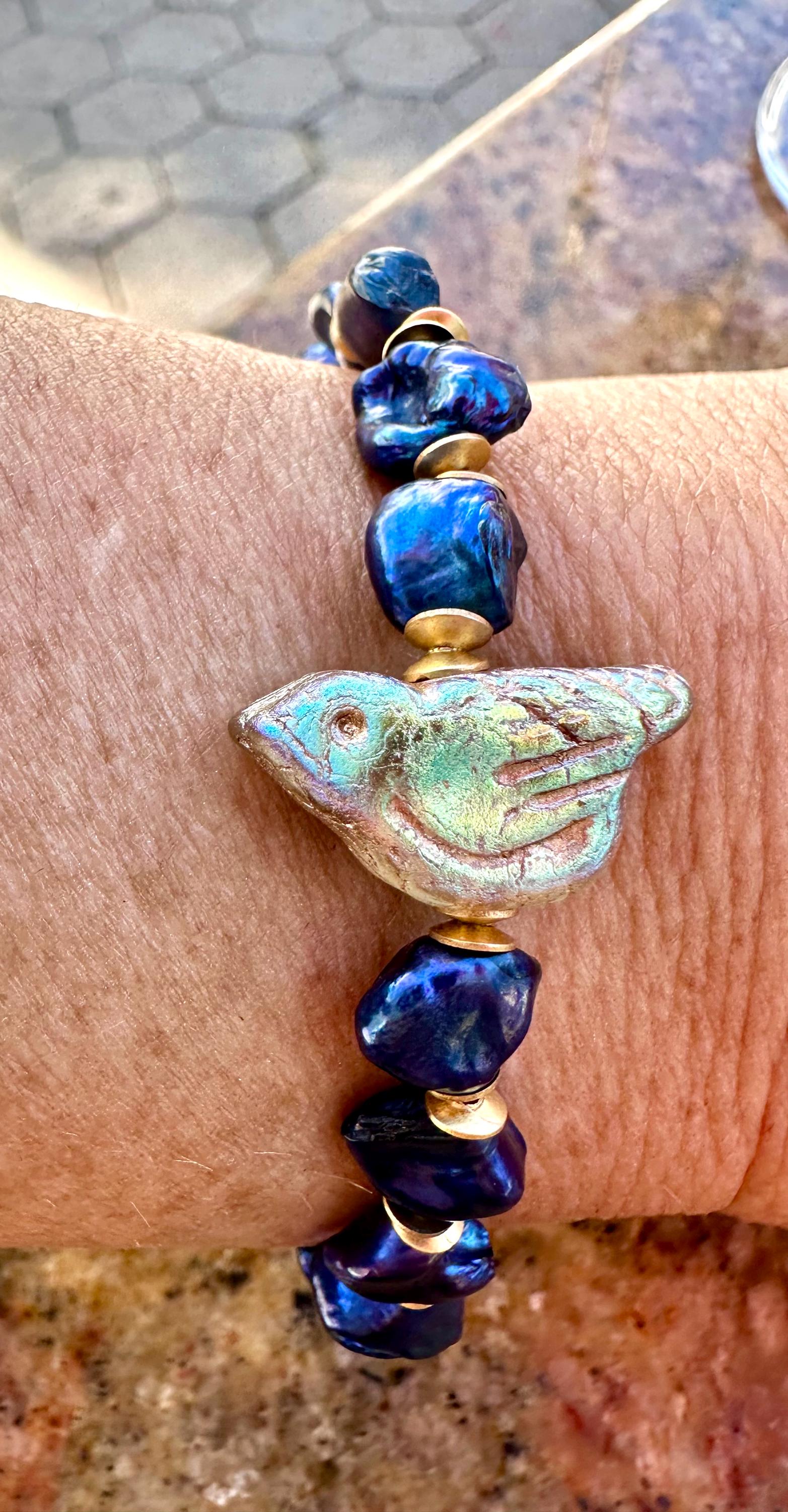 Freshwater Blue Pearl Bracelet With A Gold Songbird Charm
